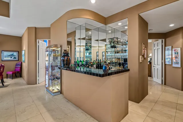 a kitchen with stainless steel appliances granite countertop a stove and a refrigerator