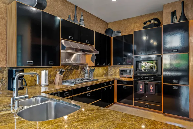 a bathroom with a tub shower and sink