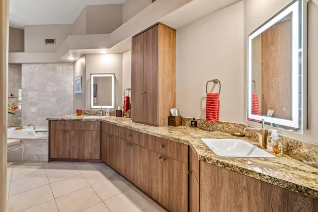 a view of a patio with a table chairs and a backyard