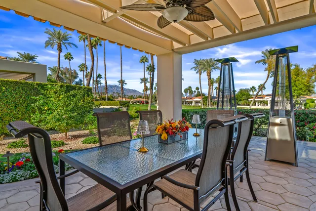 a view of a swimming pool and trees in the background