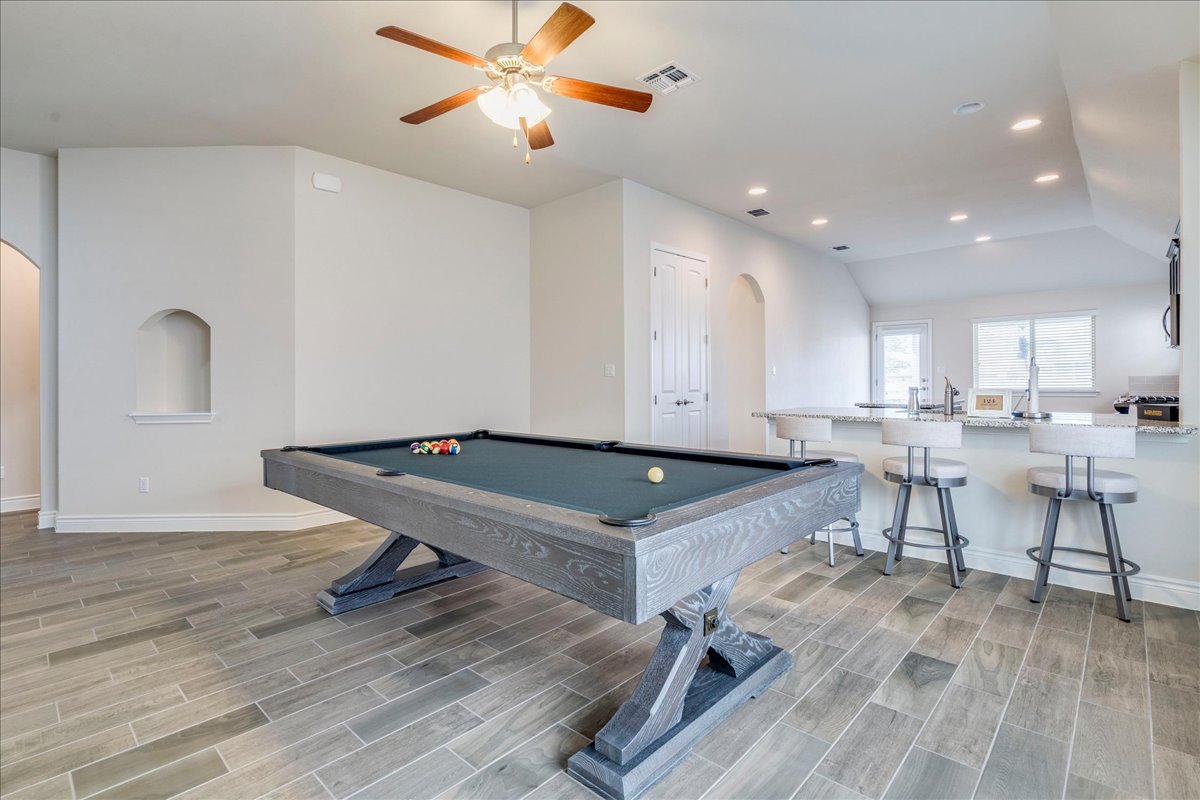 124 Compass Lane Kyle, TX 78640 - Photo 5 of 38 a room with pool table and wooden floor