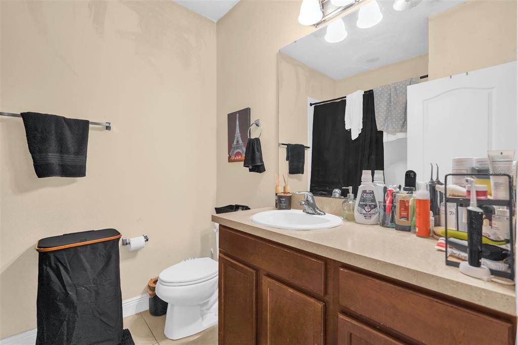 12353 Via Derna Place Windermere, FL 34786 - Photo 14 of 26 a bathroom with a toilet sink and mirror