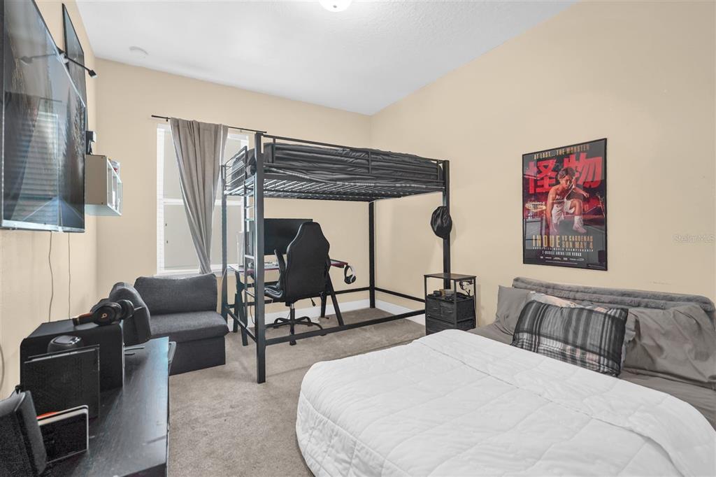 12353 Via Derna Place Windermere, FL 34786 - Photo 16 of 26 a bedroom with furniture and a bed