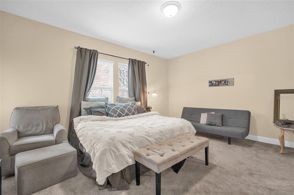 12353 Via Derna Place Windermere, FL 34786 - Photo 18 of 26 a bedroom with a bed and a couch