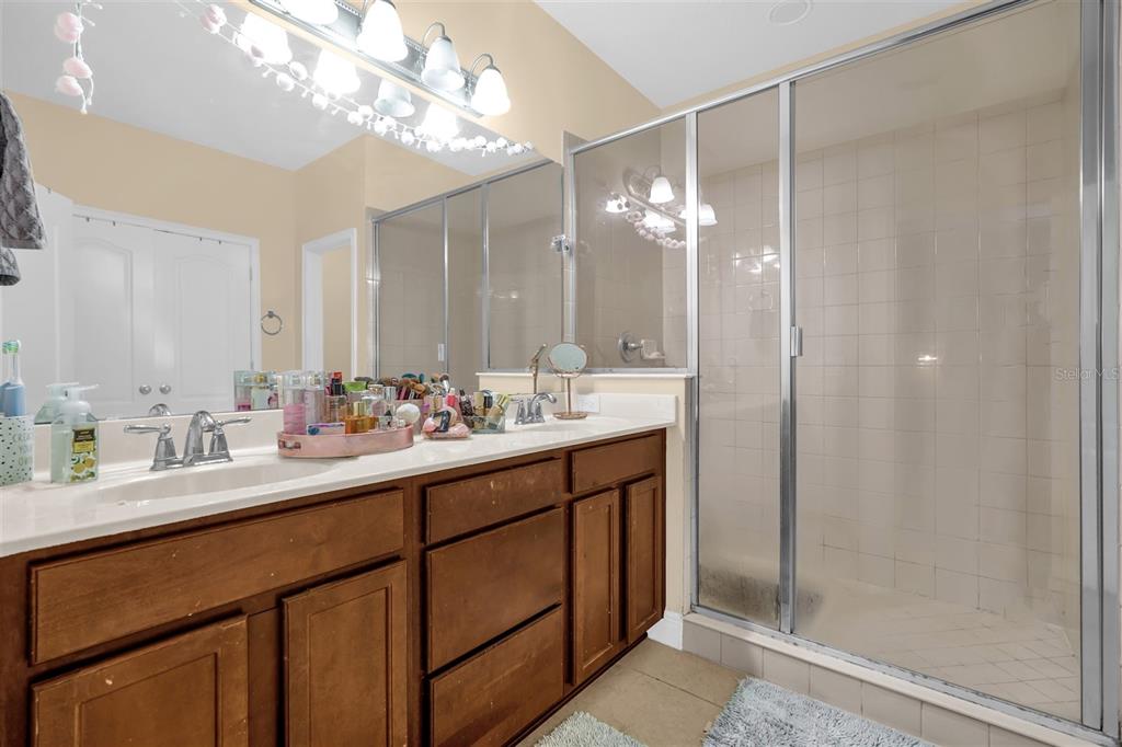 12353 Via Derna Place Windermere, FL 34786 - Photo 20 of 26 a bathroom with double vanity and a mirror