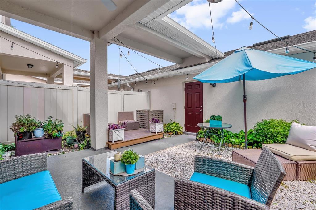 12353 Via Derna Place Windermere, FL 34786 - Photo 23 of 26 a outdoor space with plants and outdoor seating