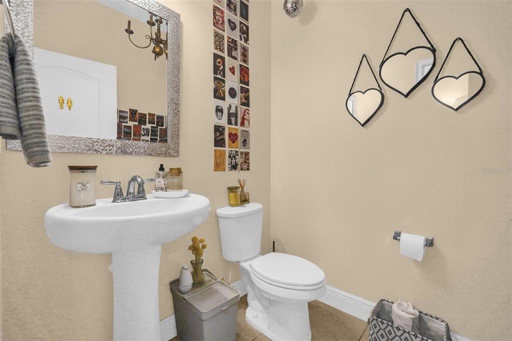 12353 Via Derna Place Windermere, FL 34786 - Photo 24 of 26 a bathroom with a sink a toilet and shower