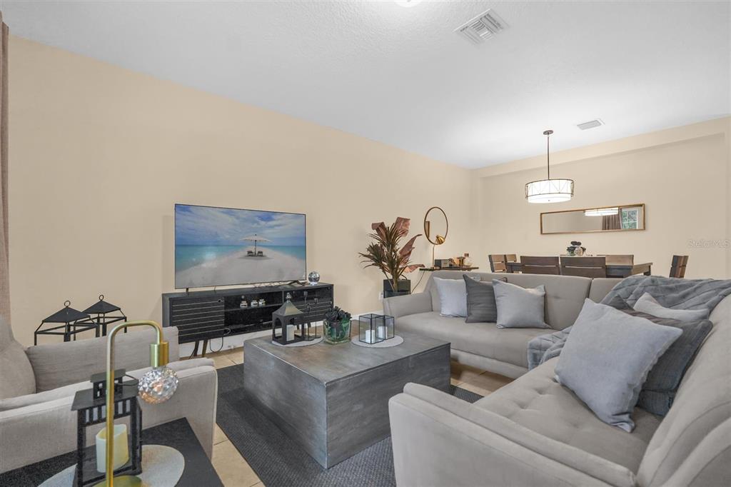 12353 Via Derna Place Windermere, FL 34786 - Photo 3 of 26 a living room with furniture and a flat screen tv