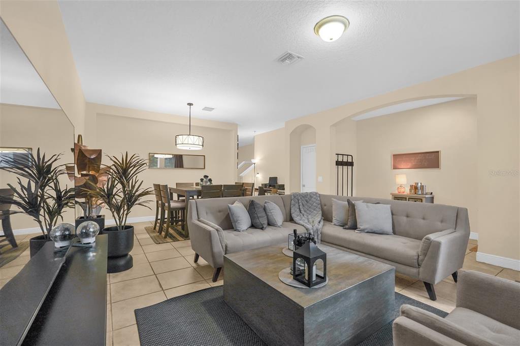 12353 Via Derna Place Windermere, FL 34786 - Photo 4 of 26 a living room with furniture and a chandelier
