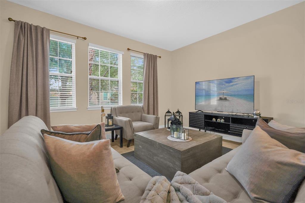 12353 Via Derna Place Windermere, FL 34786 - Photo 5 of 26 a living room with furniture and floor to ceiling window