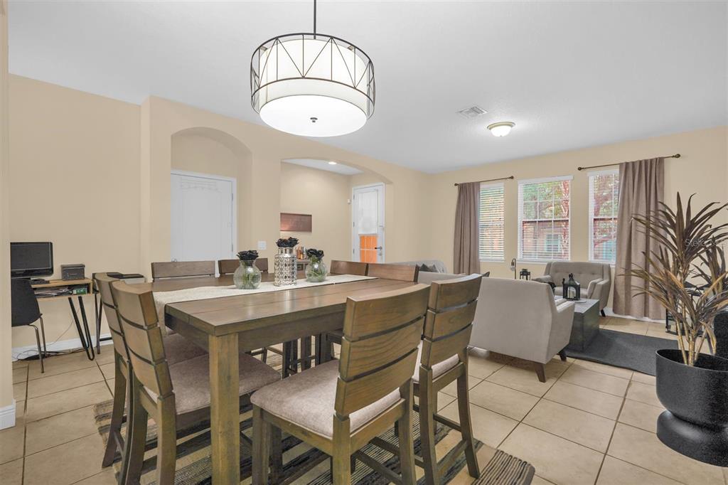 12353 Via Derna Place Windermere, FL 34786 - Photo 7 of 26 a view of a dining room with furniture window and outside view