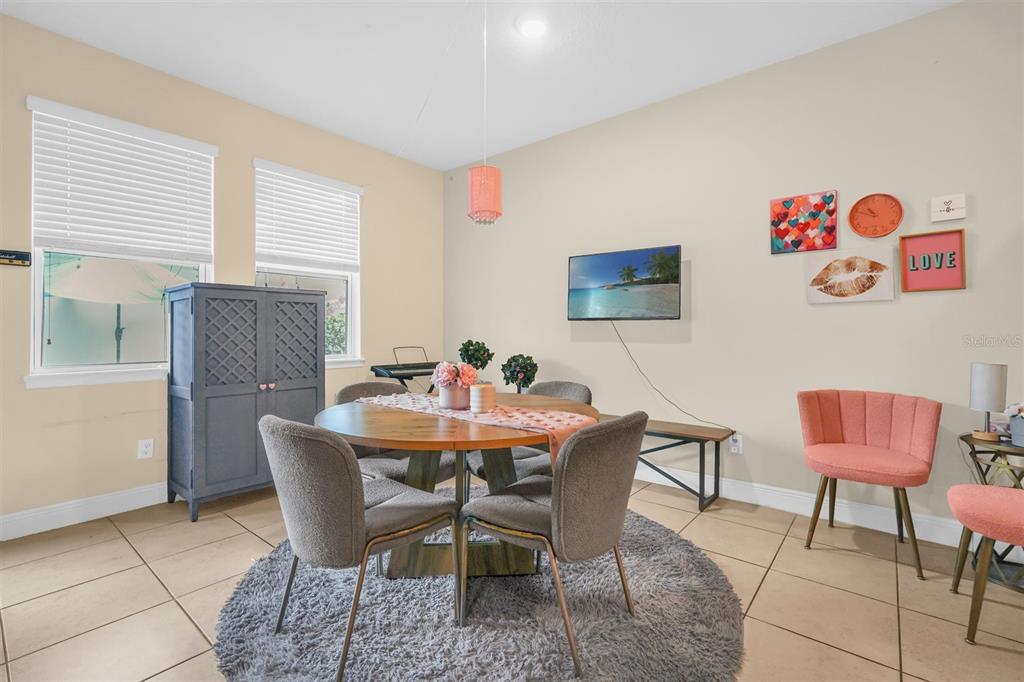 12353 Via Derna Place Windermere, FL 34786 - Photo 8 of 26 a view of a dining room with furniture and a window