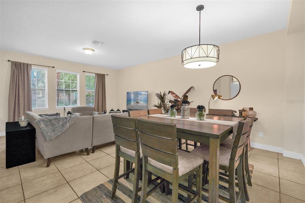 12353 Via Derna Place Windermere, FL 34786 - Photo 10 of 26 a view of a dining room with furniture window and wooden floor