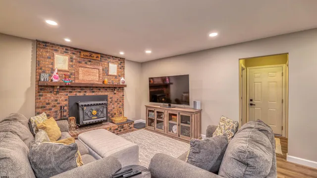 a view of an entryway with wooden floor