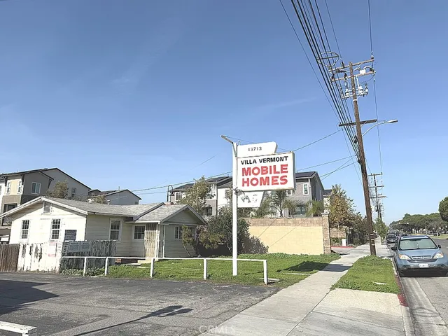 a view of a house with a floor to ceiling windows