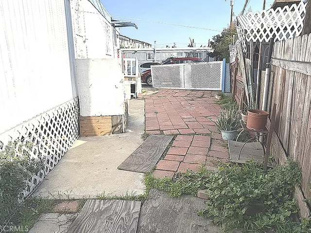 a view of a backyard with sitting area