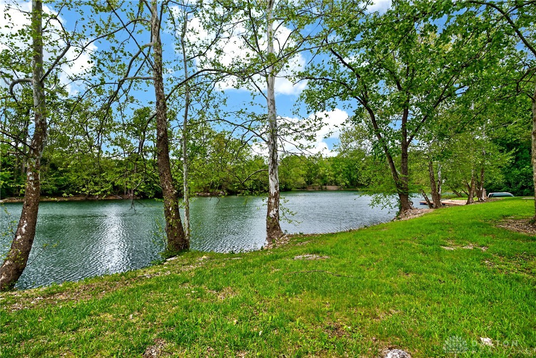 3889 Powell Road Huber Heights, OH 45424 - Photo 3 of 18 This tranquil waterfront property offers serene views and lush greenery for outdoor enjoyment.