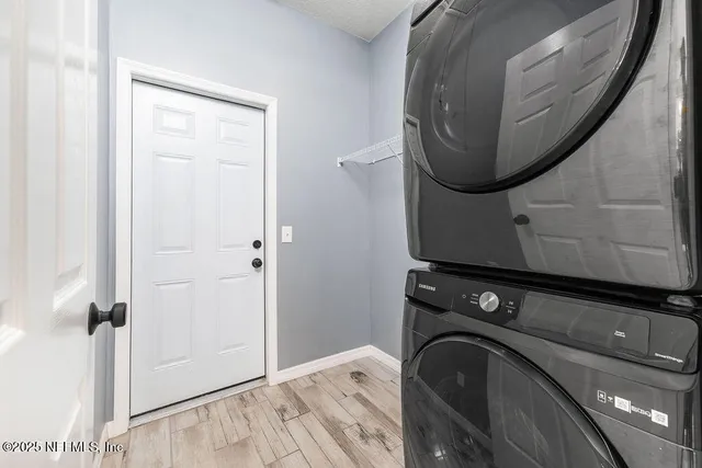 a close view of utility room with washer and dryer