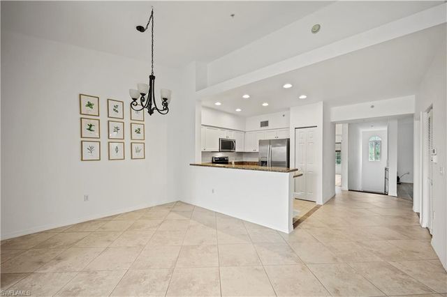 a view of a kitchen with a sink and dishwasher