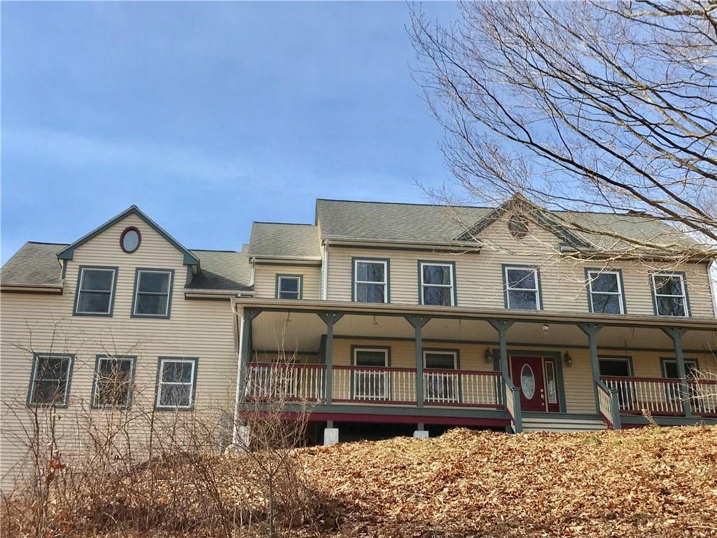 119 Bascom Road Lebanon, CT 06249 - Photo 1 of 1 a front view of a house with balcony