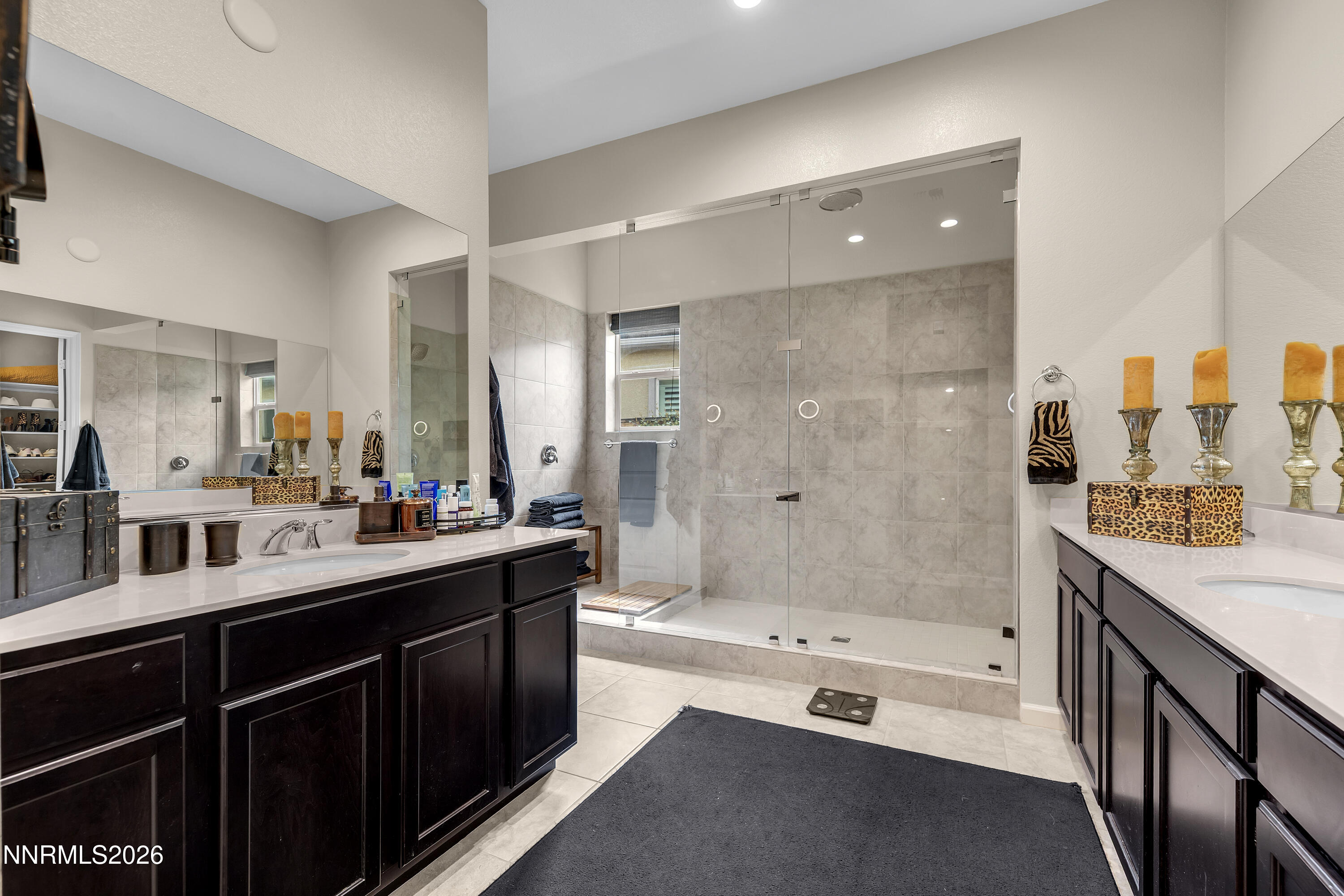 9021 Iron Sky Court Reno, NV 89523 - Photo 26 of 39 a spacious bathroom with a shower tub double sink and mirror