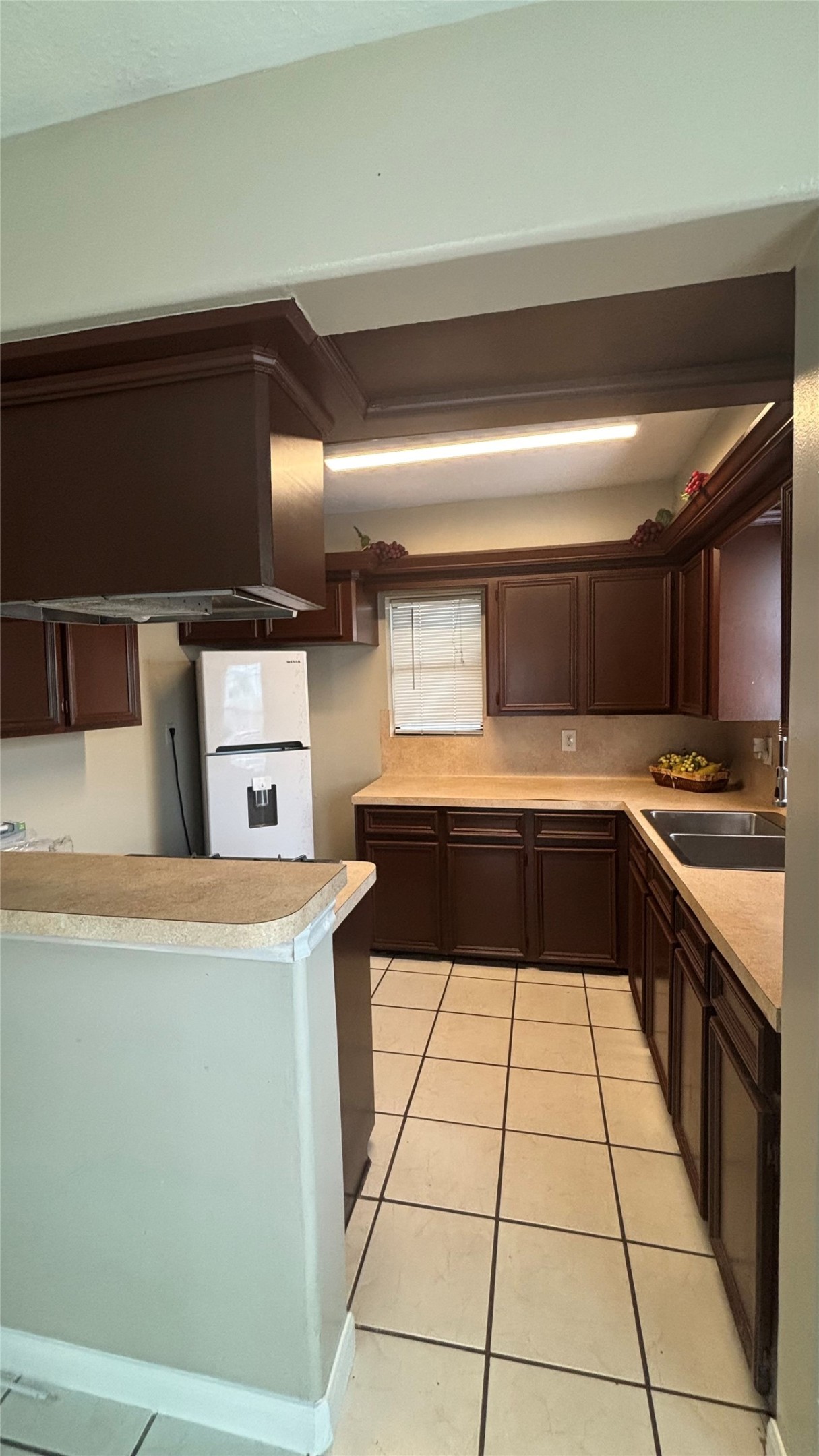 2340 Cumberland Street Houston, TX 77023 - Photo 11 of 18 a kitchen with a sink a stove and cabinets