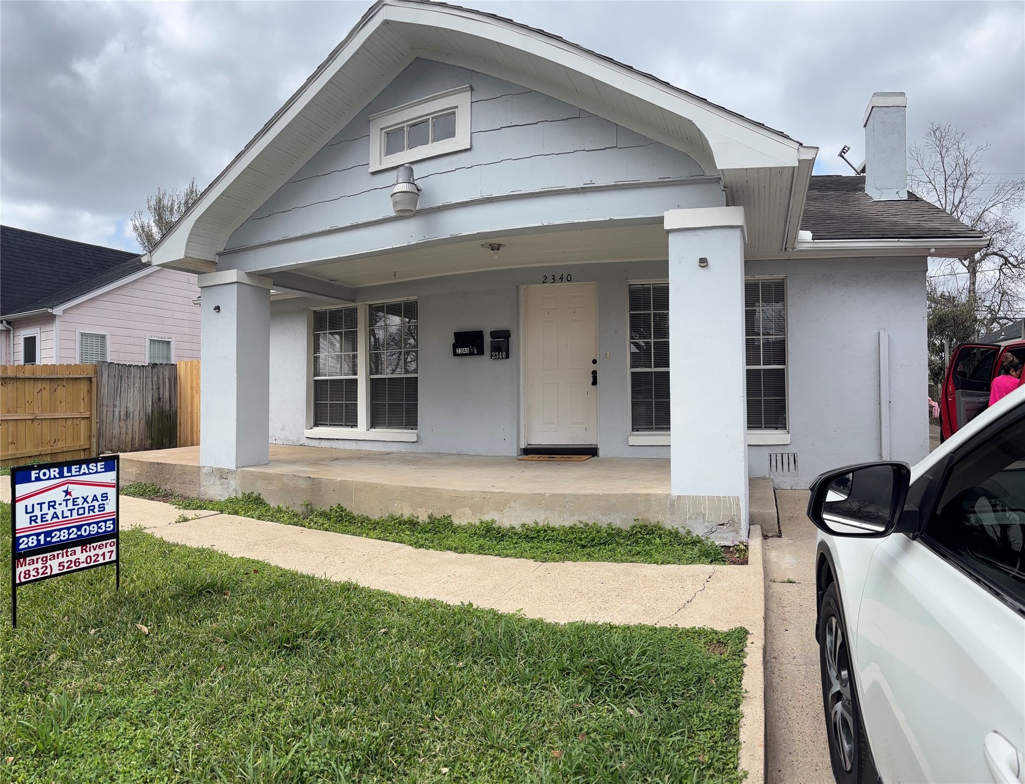 2340 Cumberland Street Houston, TX 77023 - Photo 3 of 18 a view of a house with many windows and a yard