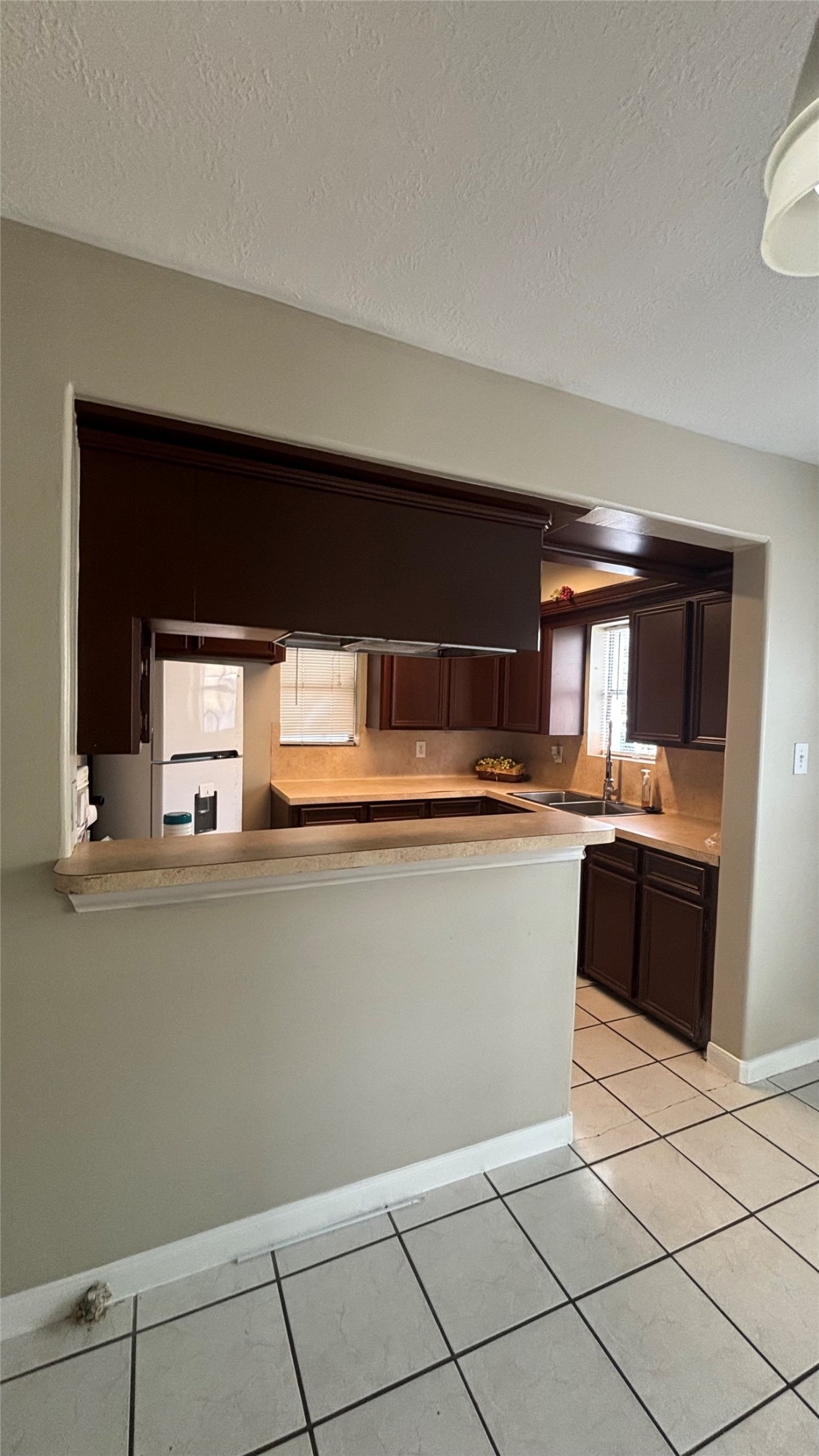 2340 Cumberland Street Houston, TX 77023 - Photo 9 of 18 a kitchen with granite countertop white cabinets and stainless steel appliances