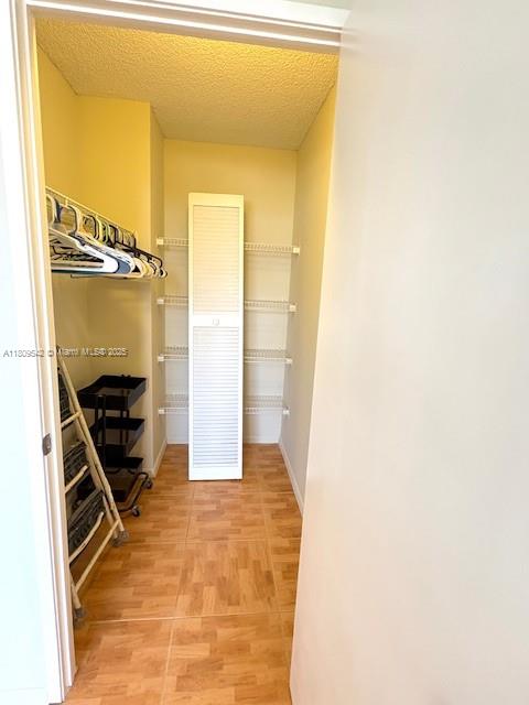 210 174th Street, Unit 818 Sunny Isles Beach, FL 33160 - Photo 19 of 25 a view of a walk in closet