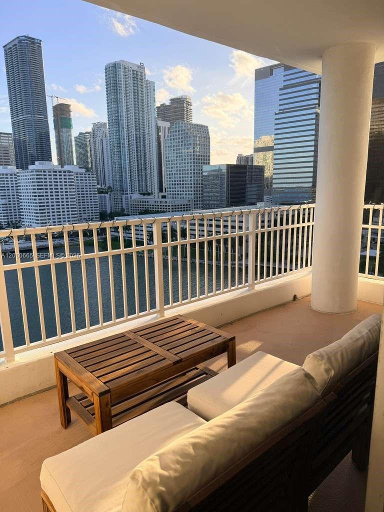 701 Brickell Key Boulevard, Unit 1501 Miami, FL 33131 - Photo 8 of 8 a roof deck with a bench