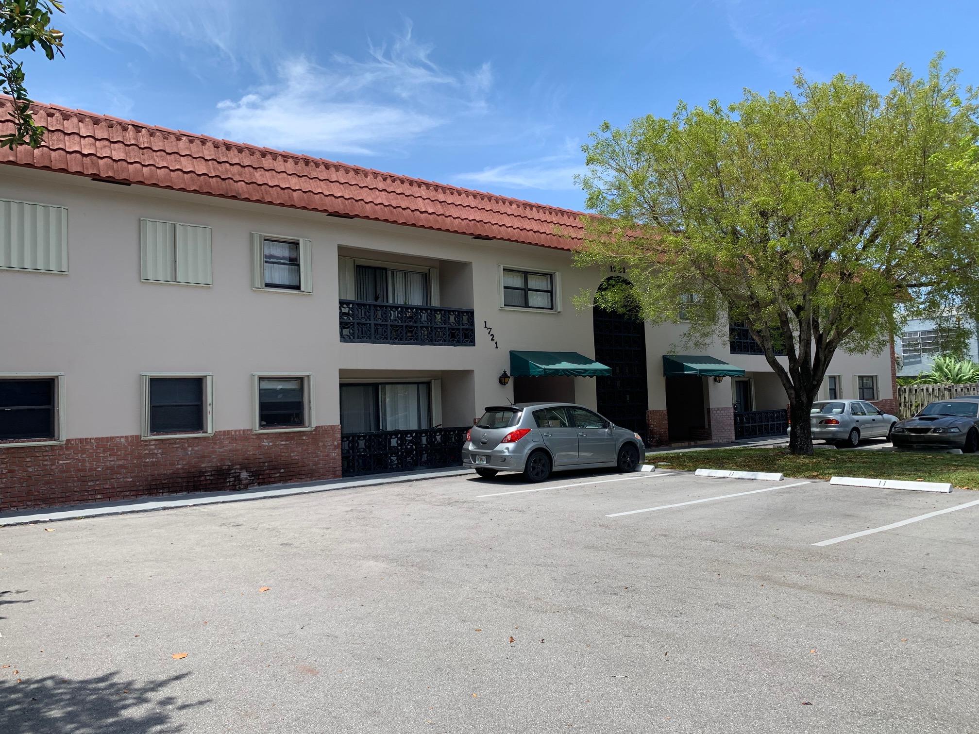 1721 Northwest 15th Vista, Unit 12 Boca Raton, FL 33432 - Photo 3 of 8 a view of a house with a yard