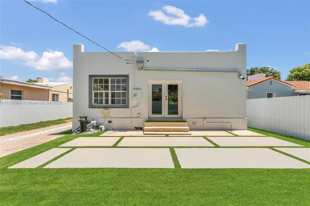 a house view with a backyard space