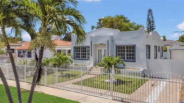 a view of house and swimming pool