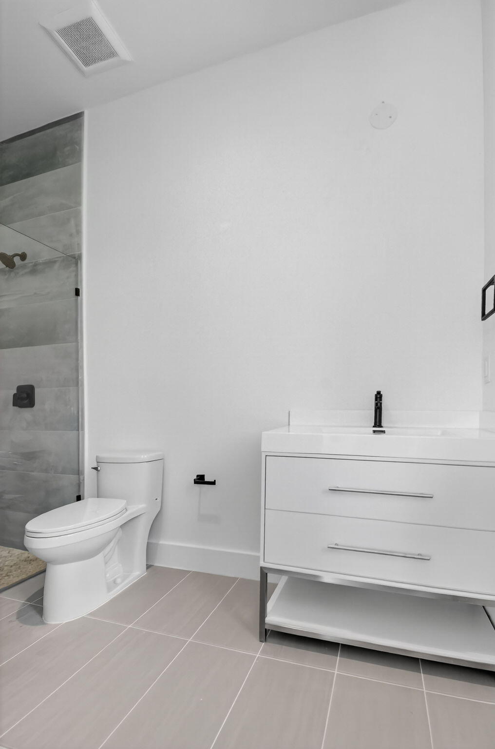 3920 Espan Court Palm Springs, FL 33461 - Photo 30 of 51 a bathroom with a toilet and a shower