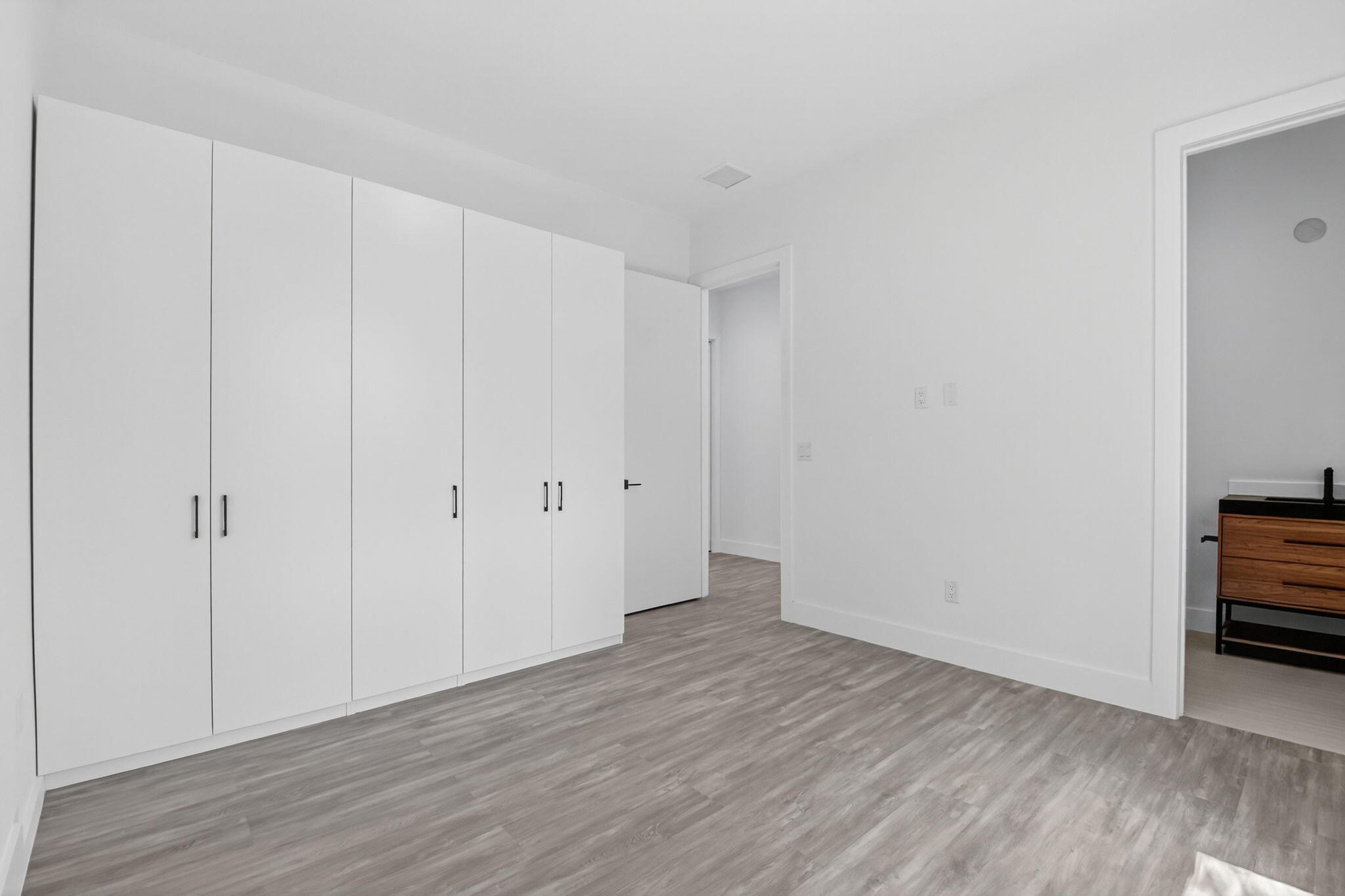 3920 Espan Court Palm Springs, FL 33461 - Photo 33 of 51 a view of an empty room with wooden floor