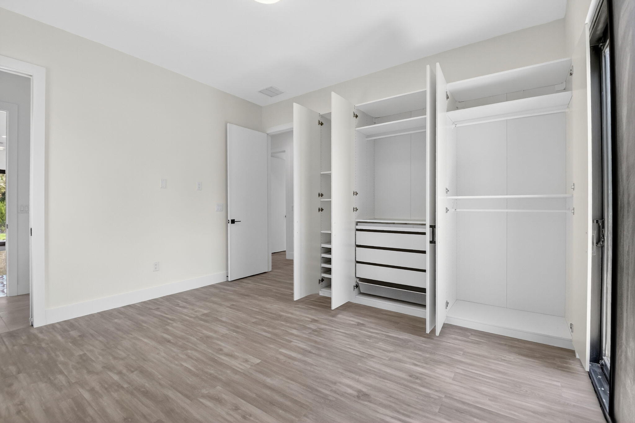 3920 Espan Court Palm Springs, FL 33461 - Photo 39 of 51 a view of walk in closet with empty racks