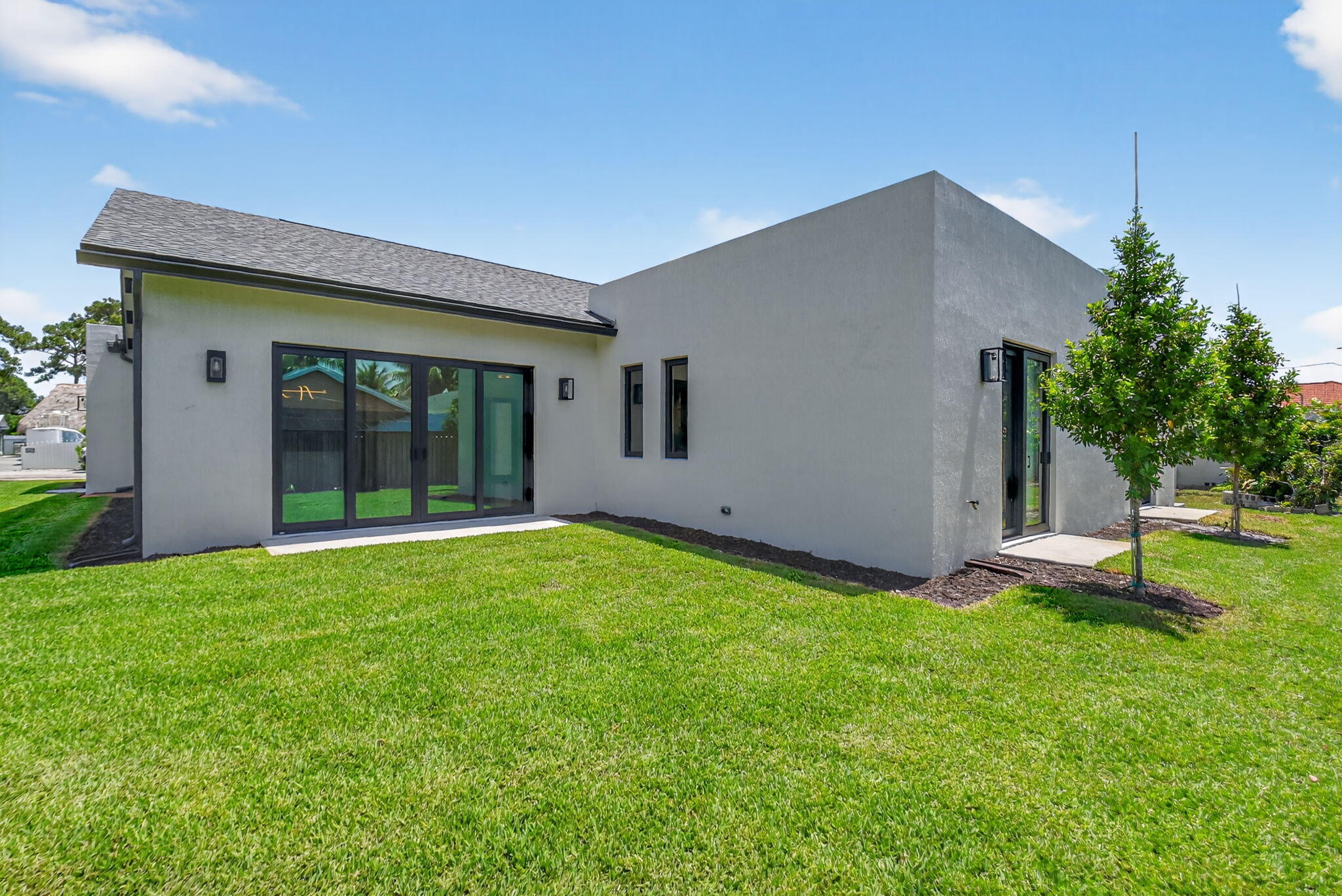 3920 Espan Court Palm Springs, FL 33461 - Photo 45 of 51 a house view with a garden space