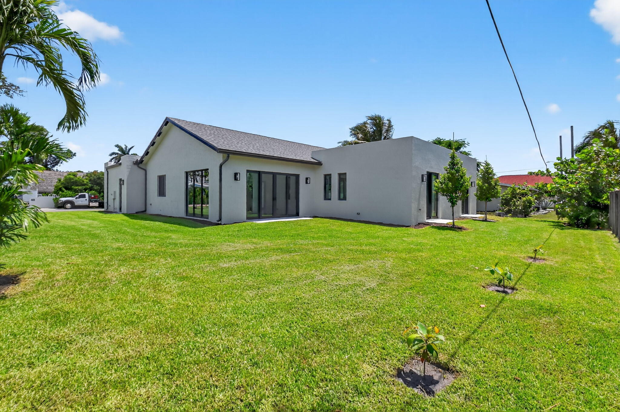 3920 Espan Court Palm Springs, FL 33461 - Photo 50 of 51 a view of a house with a yard