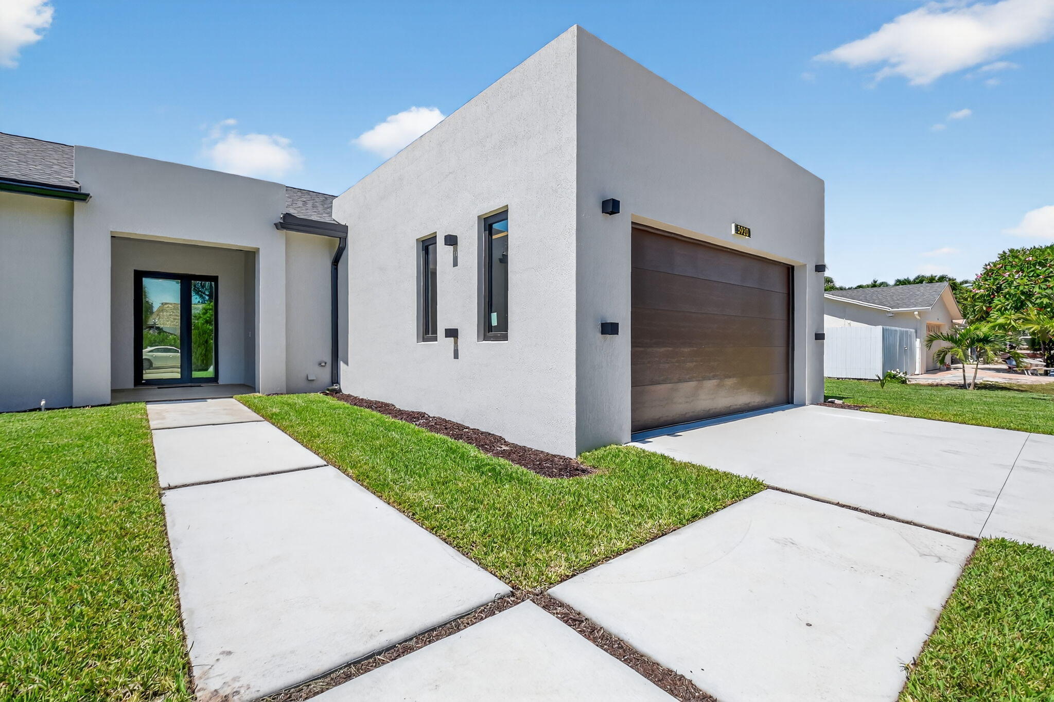 3920 Espan Court Palm Springs, FL 33461 - Photo 7 of 51 a house with yard and a outdoor space