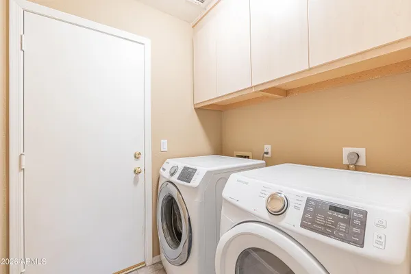 a utility room with dryer and washer