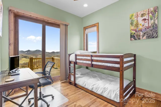 a view of a two chairs in the balcony