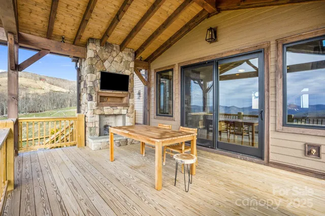 a living room with furniture a rug and a chandelier