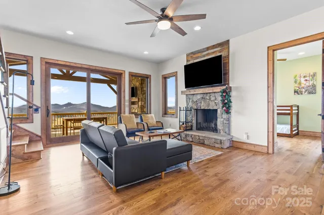 a view of a a dining room with furniture window and wooden floor