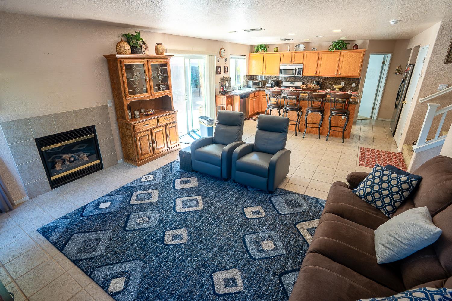 4237 Narraganset Way Mather, CA 95655 - Photo 13 of 40 a living room with furniture and a flat screen tv