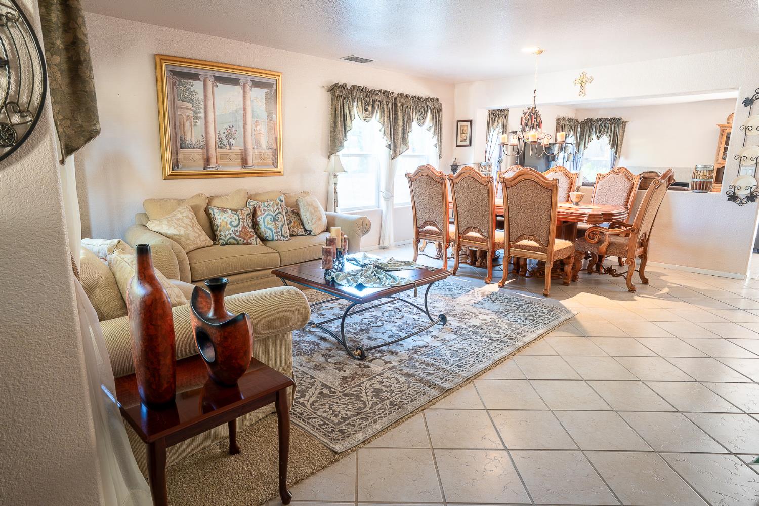 4237 Narraganset Way Mather, CA 95655 - Photo 14 of 40 a living room with furniture and a dining table