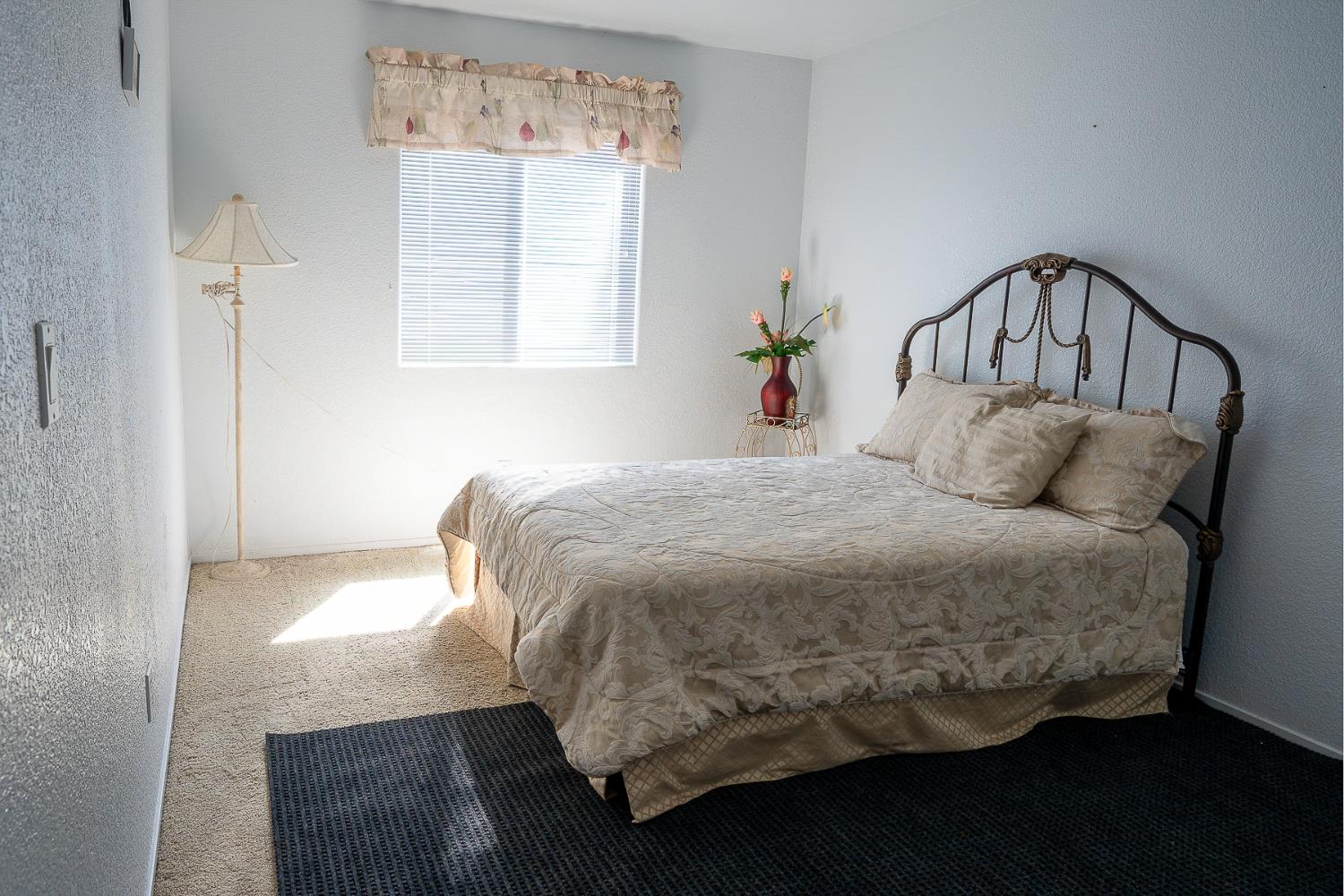 4237 Narraganset Way Mather, CA 95655 - Photo 18 of 40 a bedroom with a bed and window