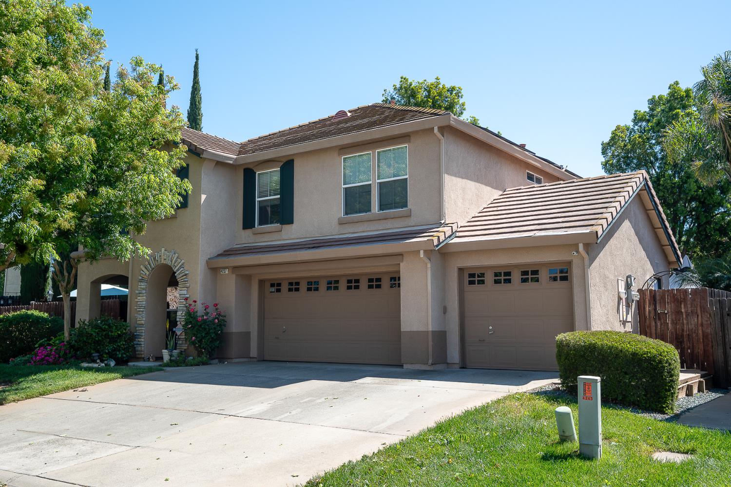 4237 Narraganset Way Mather, CA 95655 - Photo 2 of 40 a front view of a house with a yard and garage