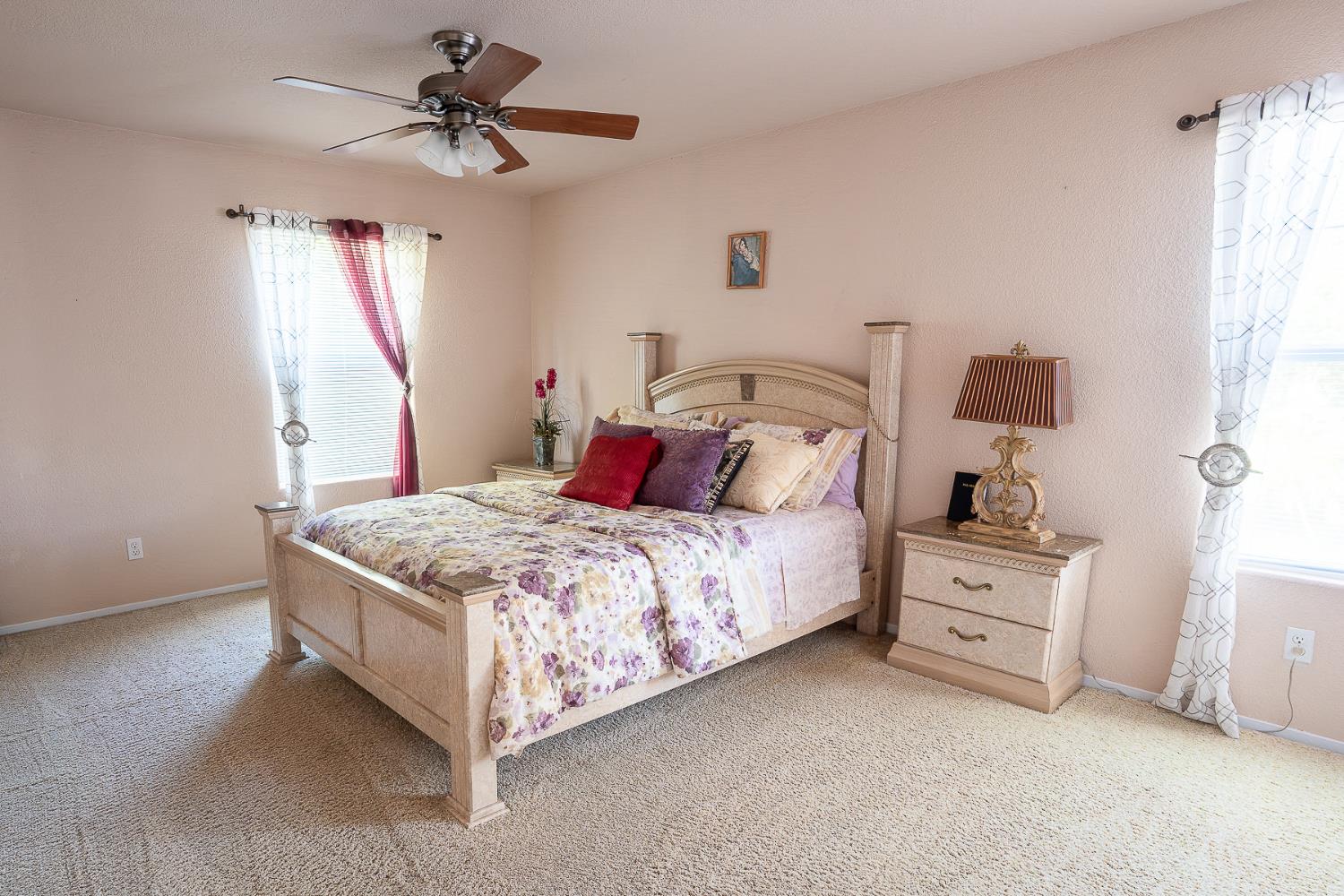 4237 Narraganset Way Mather, CA 95655 - Photo 26 of 40 a bed room with a bed and a chandelier