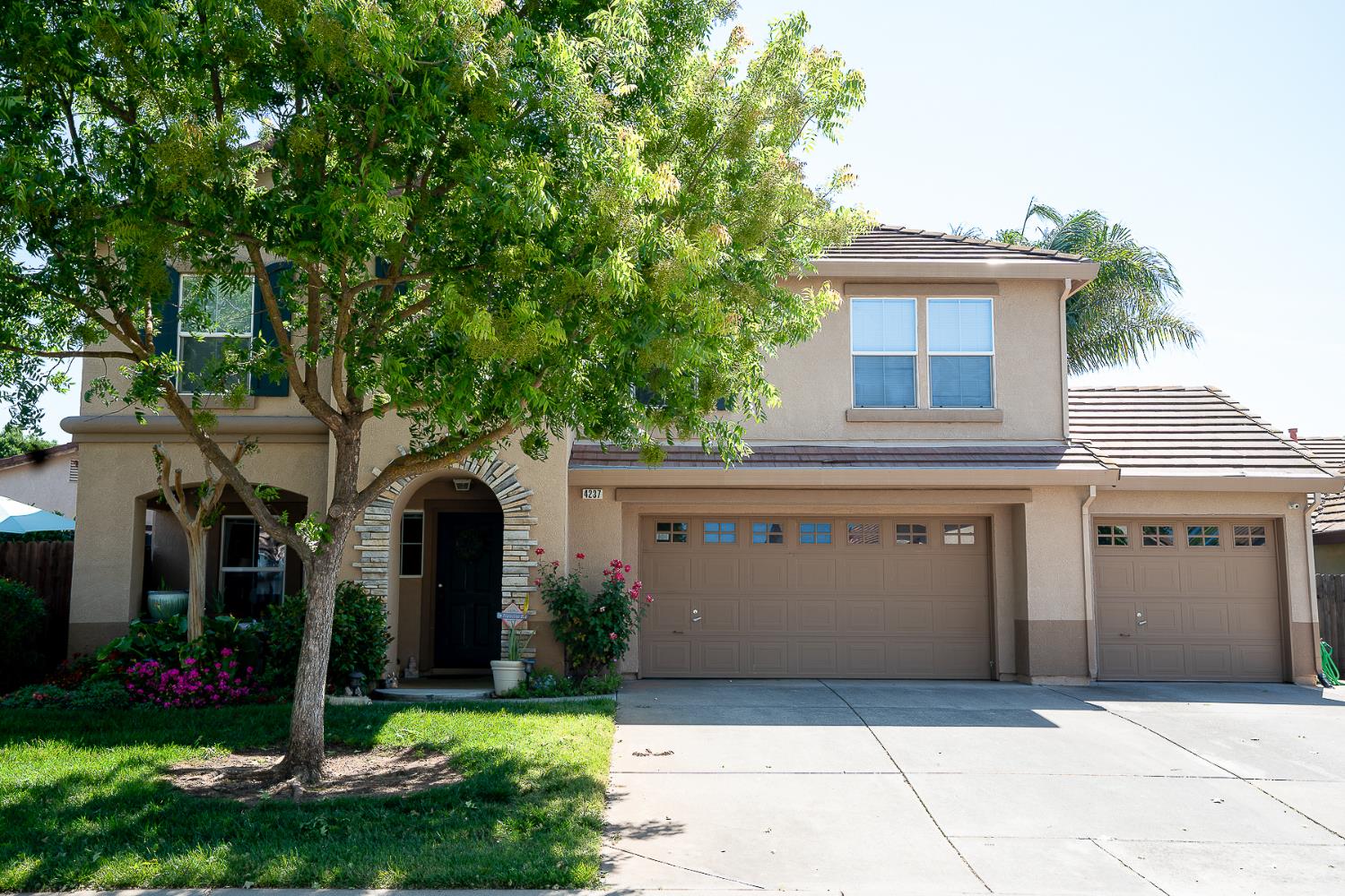 4237 Narraganset Way Mather, CA 95655 - Photo 3 of 40 a front view of a house with garden