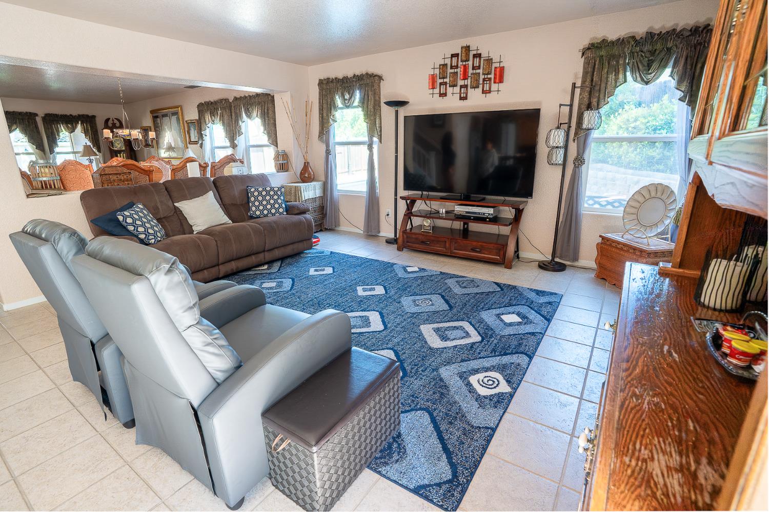 4237 Narraganset Way Mather, CA 95655 - Photo 6 of 40 a living room with furniture and a flat screen tv